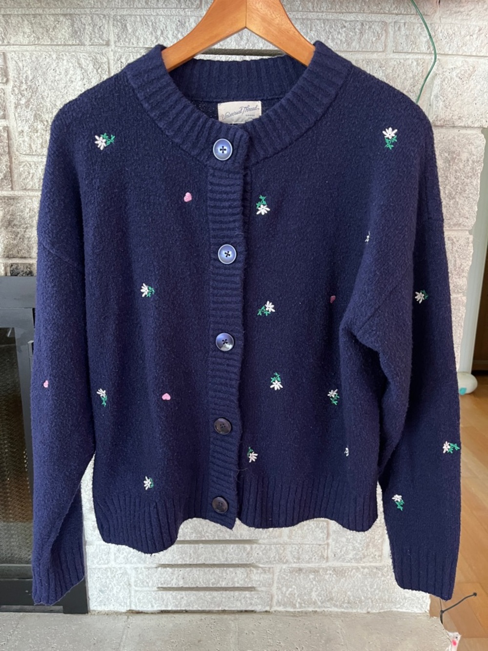 Navy Blue Soft Sweater with pink hearts and white flowers.  Sz M